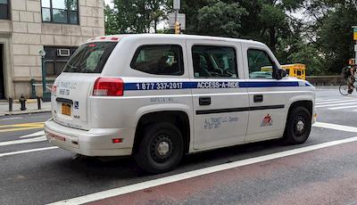 An Access-A-Ride car on the street